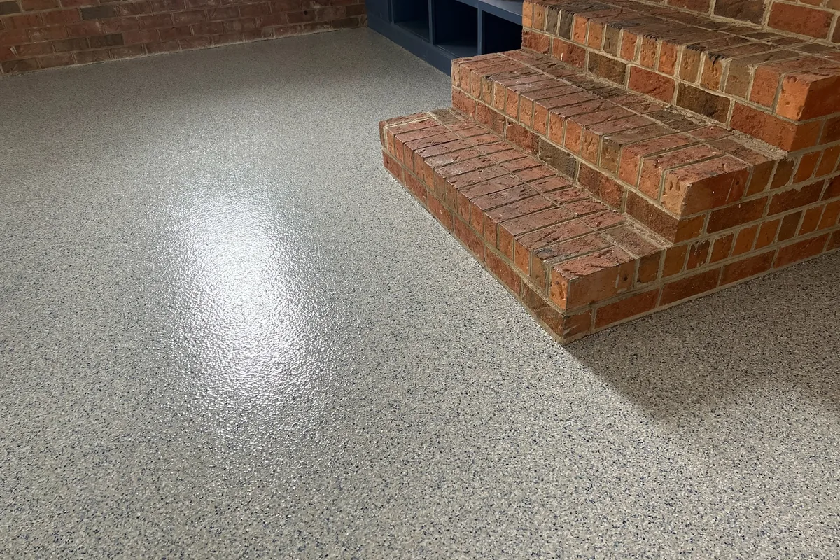 Polyaspartic flake garage floor coating installed in a Raleigh, NC residential garage by NC Garage Floors