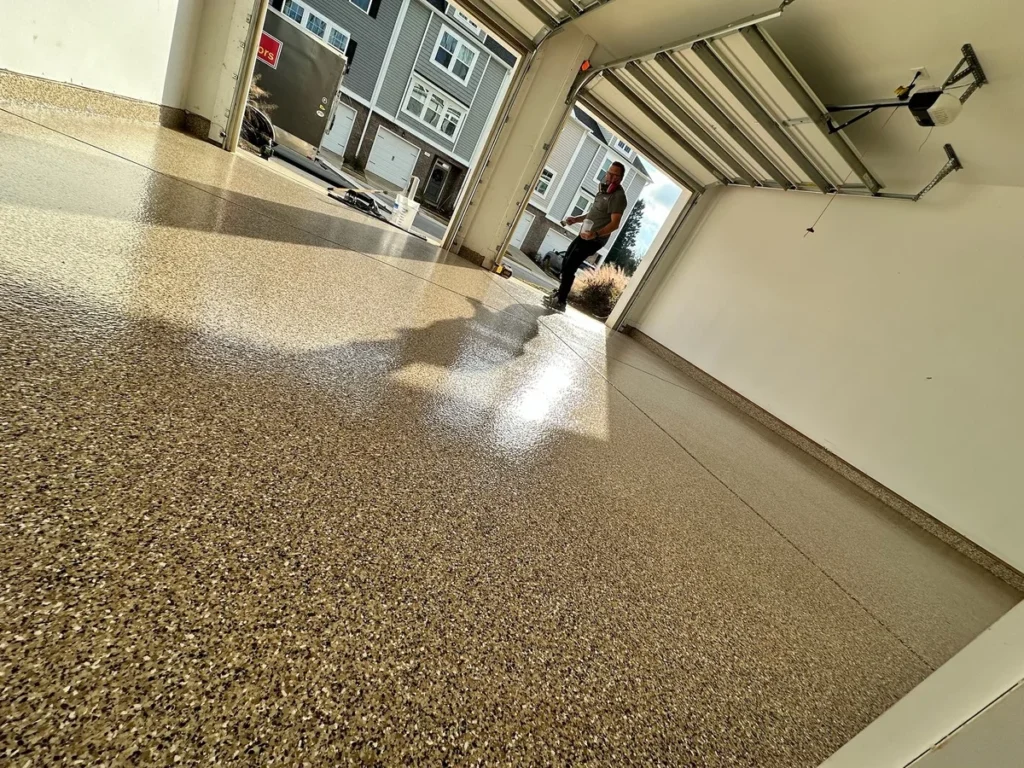 Professional shop floor epoxy coating in a commercial bay in Fuquay-Varina, NC by NC Garage Floors