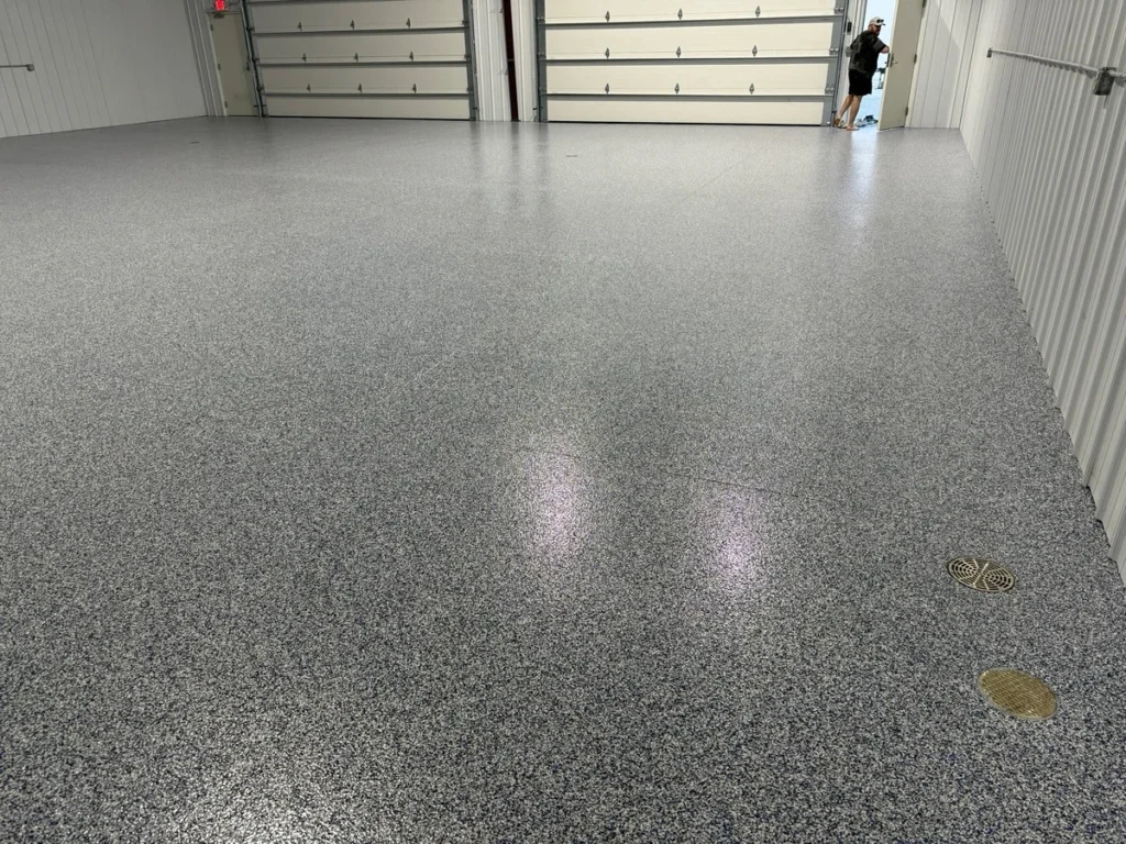 Wide-angle view of a fully finished polyaspartic flake garage floor coating in the Raleigh, NC area by NC Garage Floors